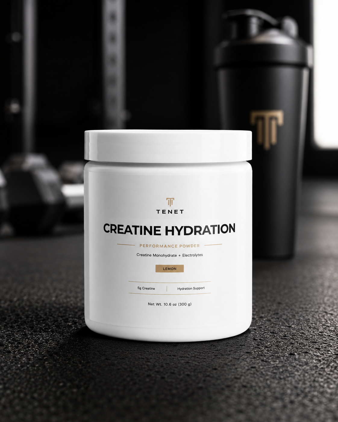 A Tenet Creatine Hydration jar next to a black Tenet-branded shaker in a gym.